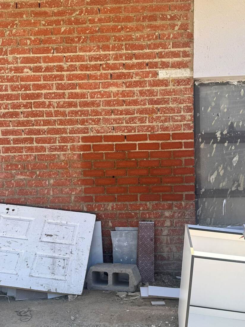 Facebrick wall with tinting correction in progress