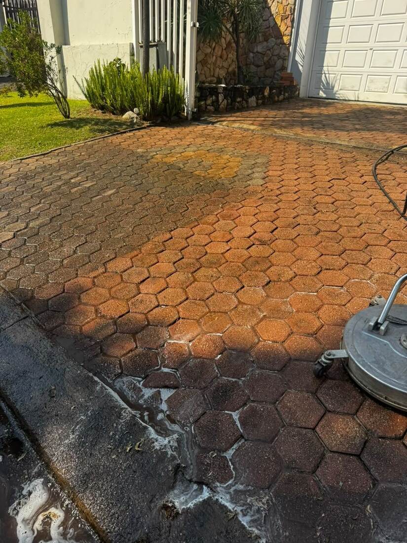 Hexagon driveway paving being pressure cleaned