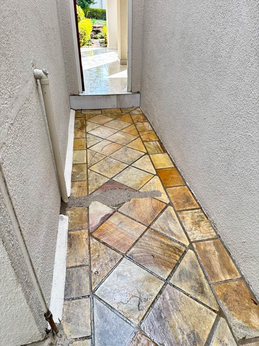 Slate walkway after cleaning, showing restored natural colour